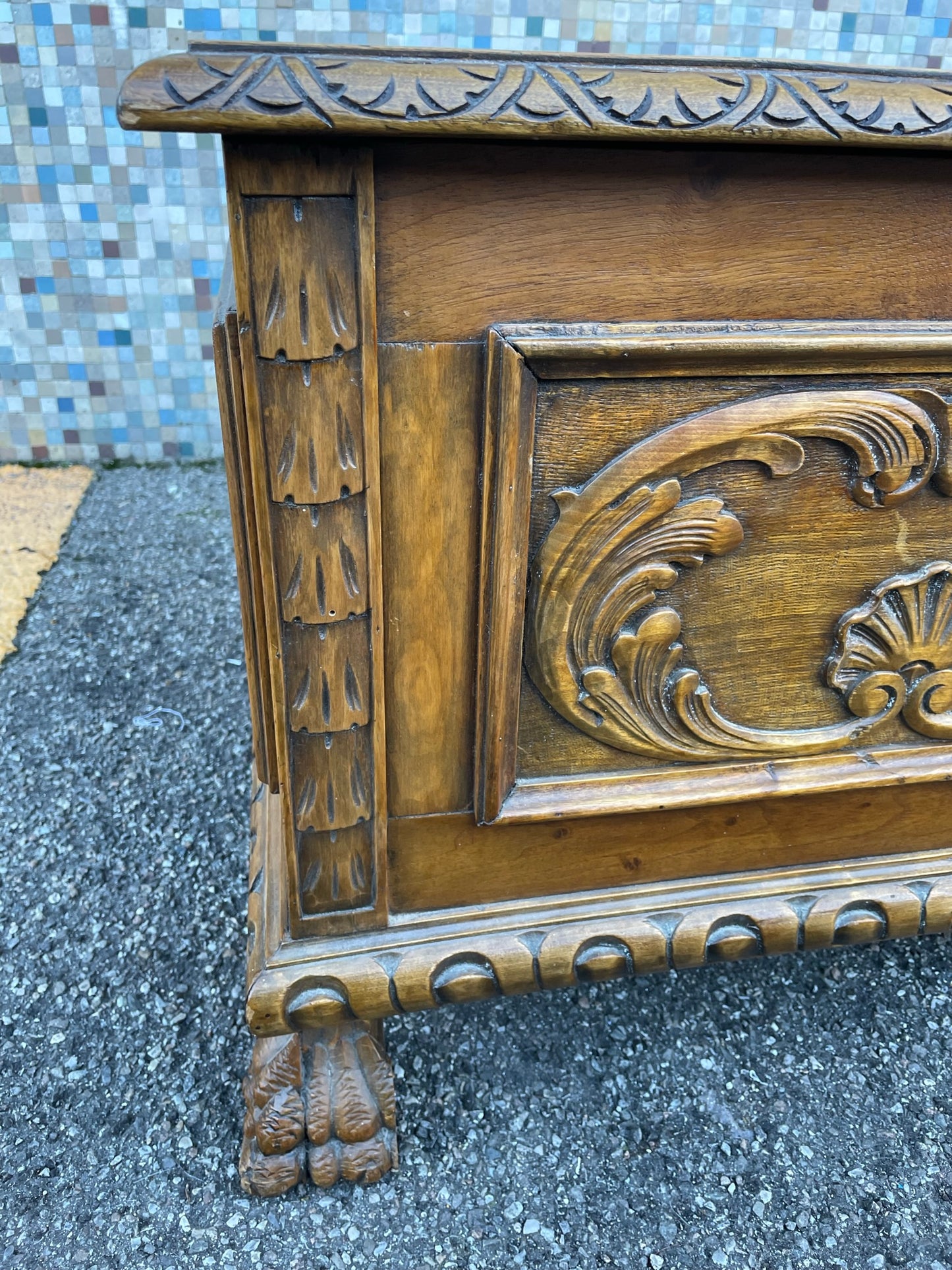 Wooden chest with lion's feet