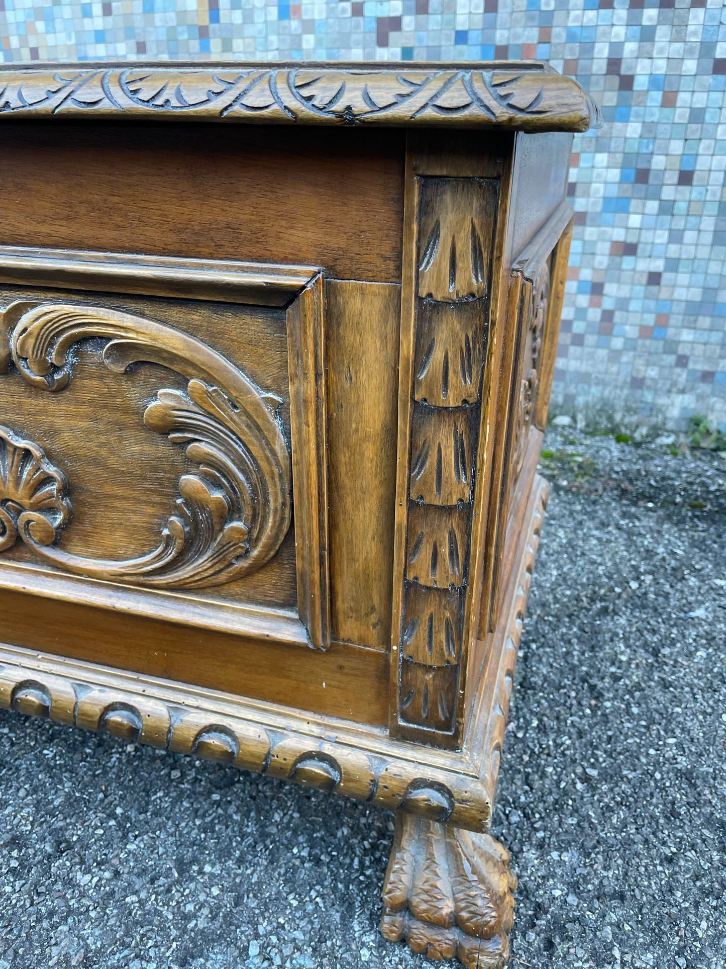 Wooden chest with lion's feet